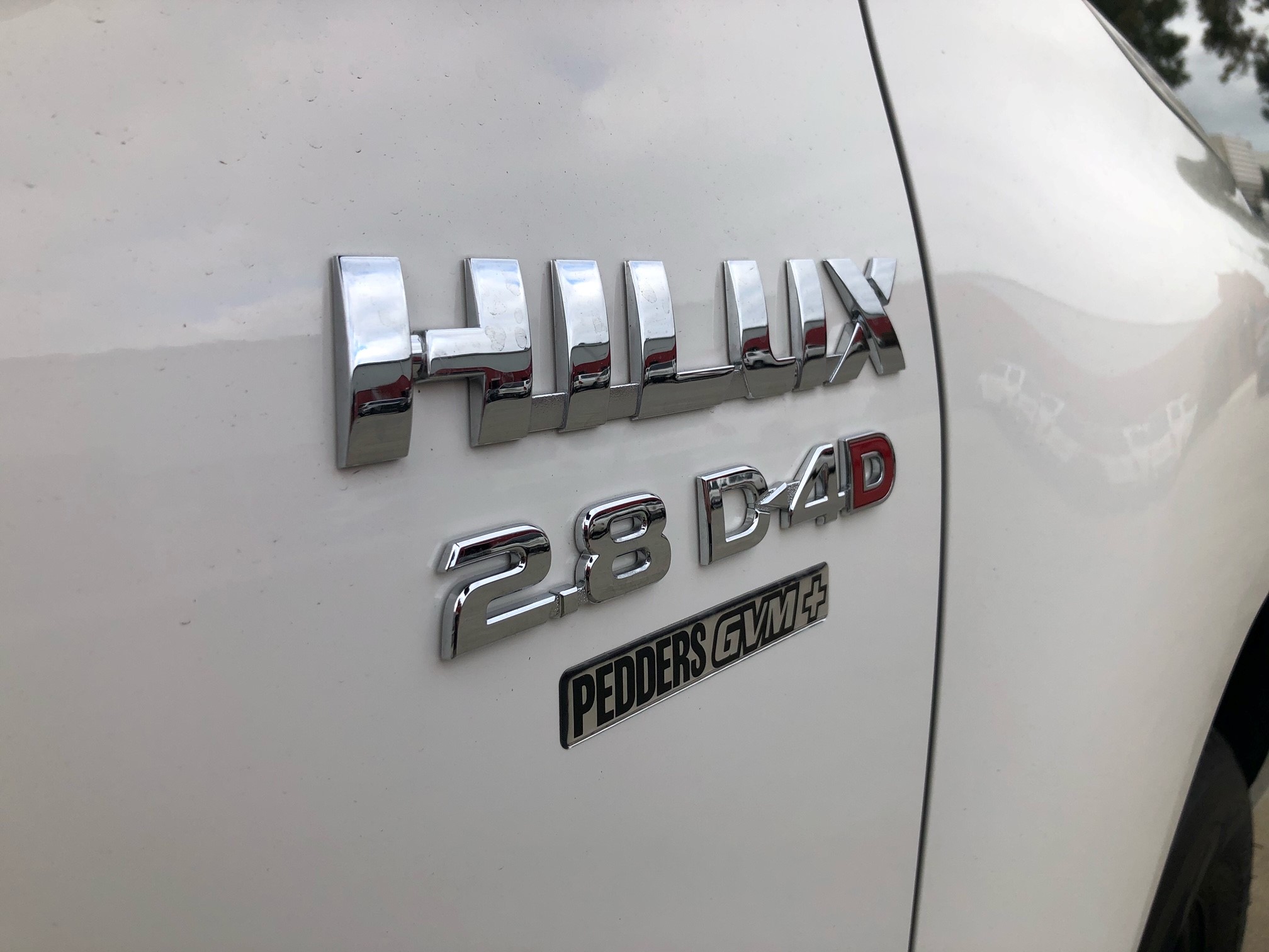 Hilux Badge with Pedders Suspension Badge