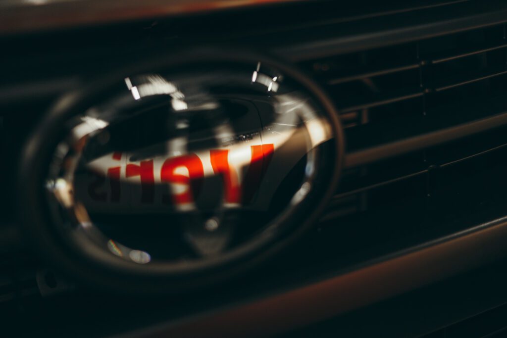 Toyota Hilux badge with Veris signage reflection