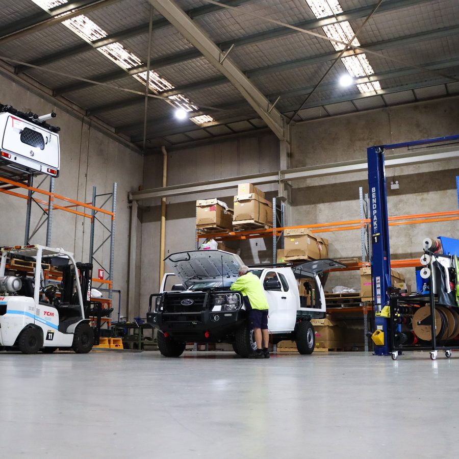 Technician inspecting Ford service ute
